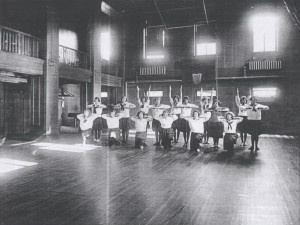 Photo of students at desks, taken around 1920